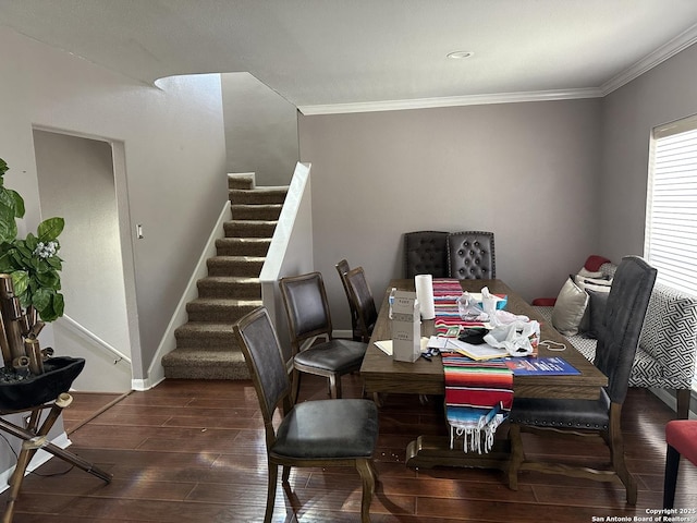 dining space with ornamental molding, stairway, wood finished floors, and baseboards