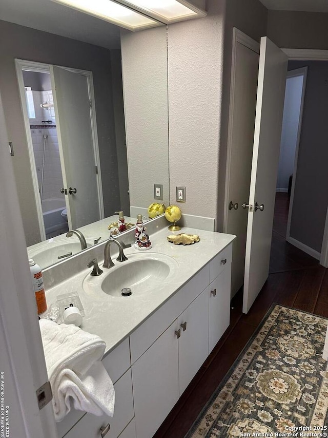 bathroom featuring vanity and wood finished floors