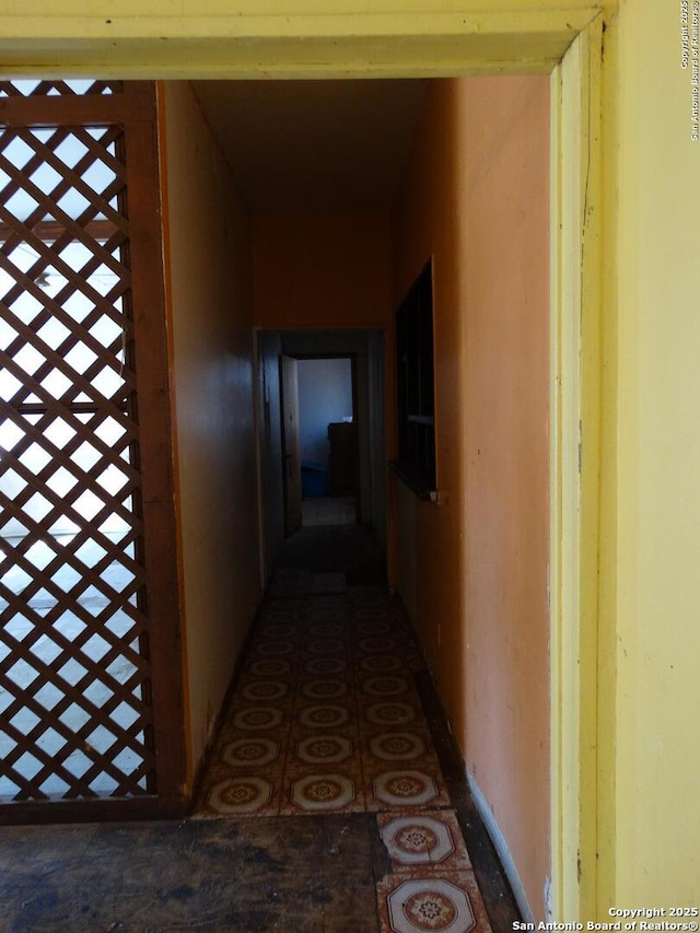 hall featuring tile patterned flooring