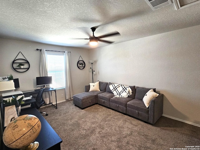 carpeted living area with ceiling fan, a textured ceiling, visible vents, and baseboards