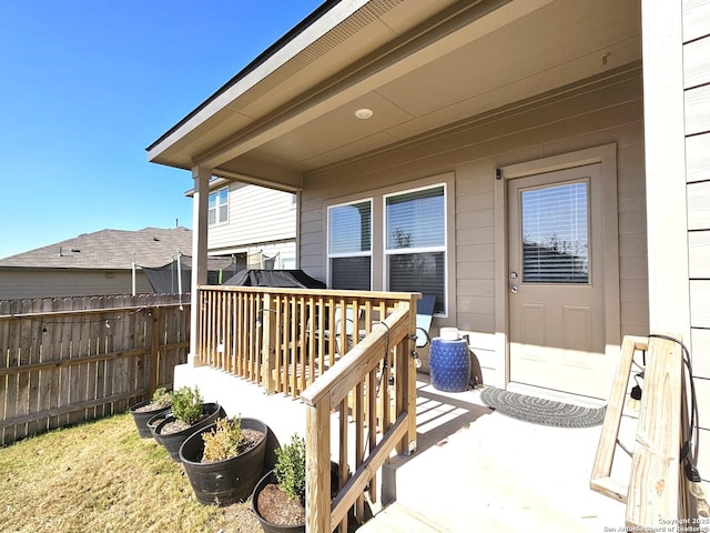 exterior space featuring fence and a wooden deck