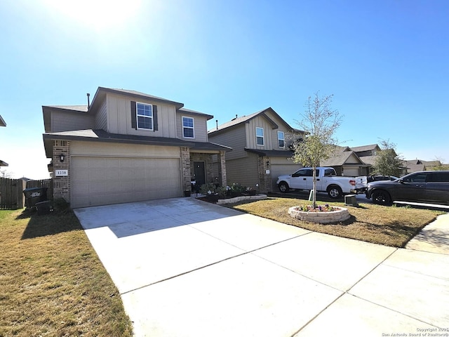 traditional-style house with a garage, concrete driveway, fence, and board and batten siding