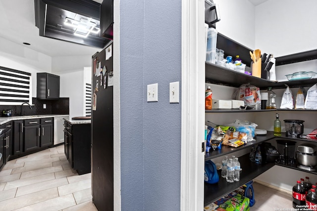 pantry with a sink