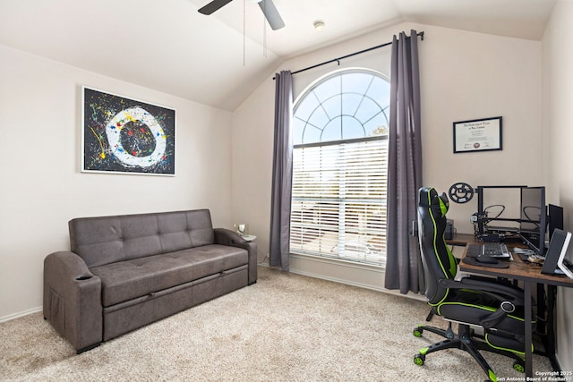 office space featuring carpet floors, lofted ceiling, baseboards, and a ceiling fan