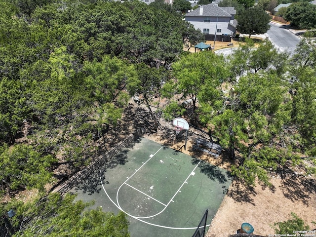 view of basketball court with community basketball court and fence