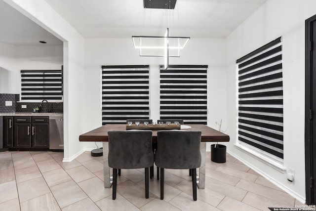 dining space with light tile patterned floors