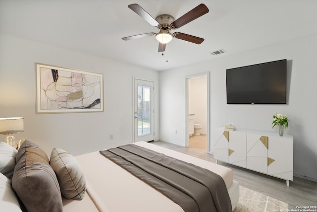 bedroom featuring visible vents, connected bathroom, ceiling fan, access to outside, and light wood-type flooring