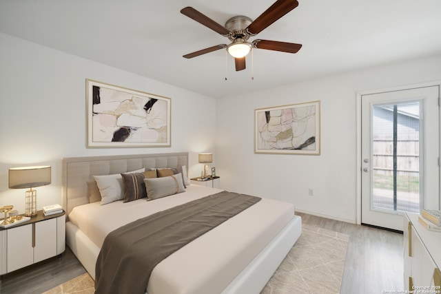 bedroom with access to outside, ceiling fan, and light wood-style flooring