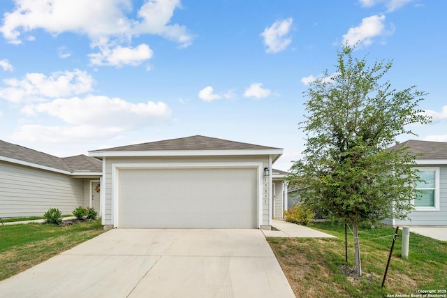 ranch-style house with a front lawn, concrete driveway, and an attached garage