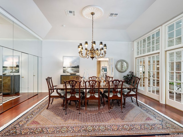 10 Parman Pl, San Antonio, TX 78230 - dining area with wood finished floors, a chandelier, healthy amount of natural light, and a high ceiling