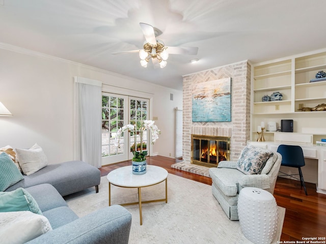 10 Parman Pl, San Antonio, TX 78230 - living room featuring wood finished floors, a brick fireplace, ornamental molding, a ceiling fan, and a desk