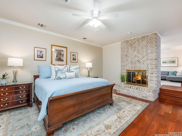 10 Parman Pl, San Antonio, TX 78230 - bedroom with ornamental molding, wood finished floors, a fireplace, and ceiling fan