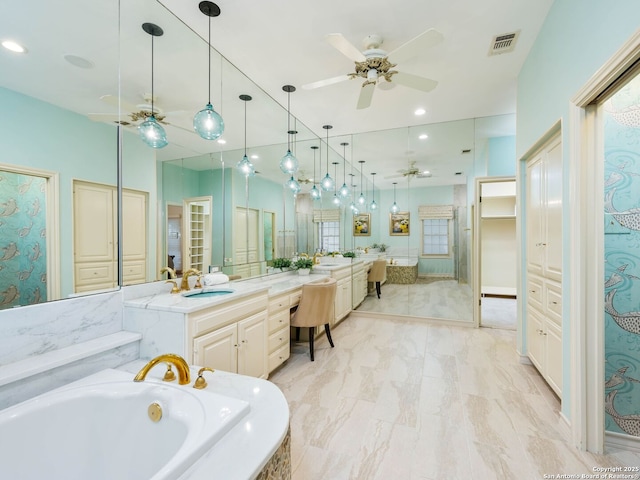 10 Parman Pl, San Antonio, TX 78230 - bathroom with ceiling fan, a garden tub, vanity, and recessed lighting