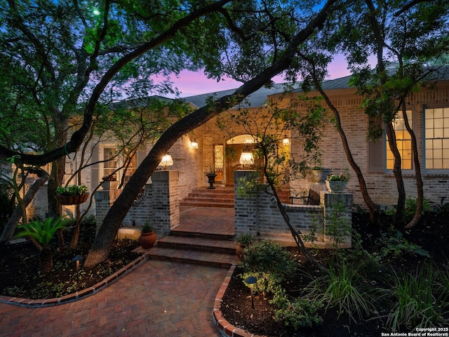 10 Parman Pl, San Antonio, TX 78230 - exterior entry at dusk with brick siding
