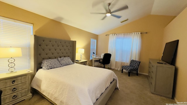 bedroom with light carpet, ceiling fan, visible vents, and vaulted ceiling