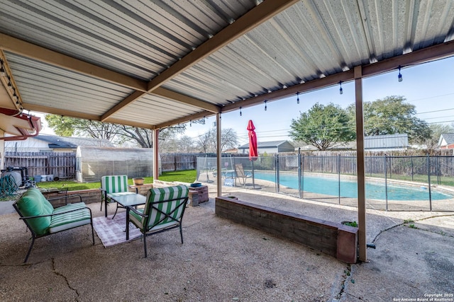 view of patio / terrace with a fenced in pool and a fenced backyard