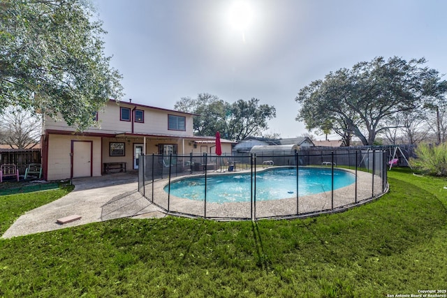 view of pool with a fenced in pool, a patio area, a fenced backyard, and a lawn