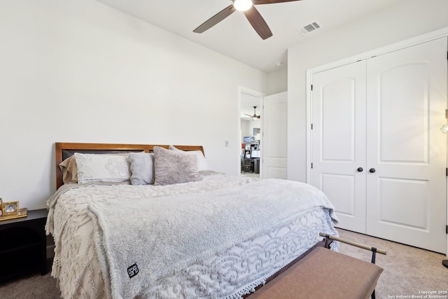 bedroom featuring carpet, a closet, visible vents, and ceiling fan