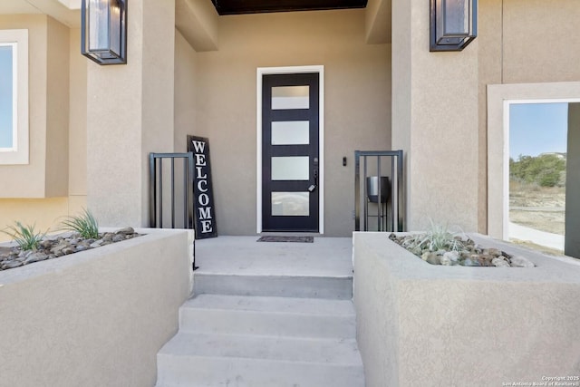 entrance to property with stucco siding