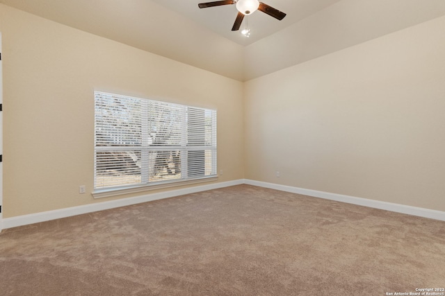 unfurnished room featuring carpet floors, baseboards, and a ceiling fan