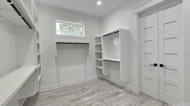 spacious closet with light wood-type flooring