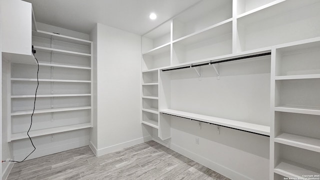 walk in closet featuring light wood-type flooring