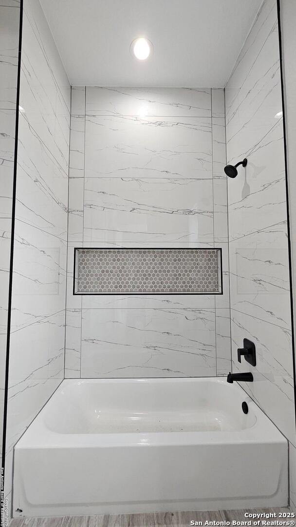 full bathroom with shower / bath combination