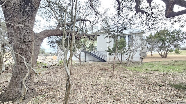 view of property exterior with stairway