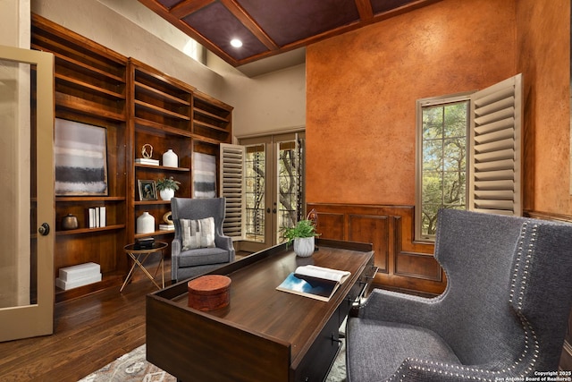 office space featuring french doors, beam ceiling, dark wood finished floors, a towering ceiling, and coffered ceiling