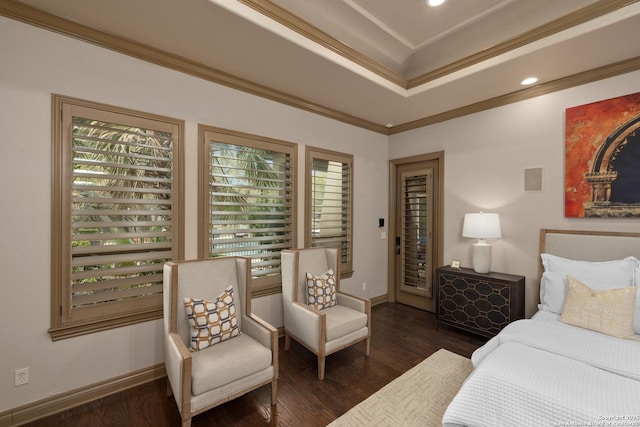 bedroom with multiple windows, baseboards, crown molding, and wood finished floors