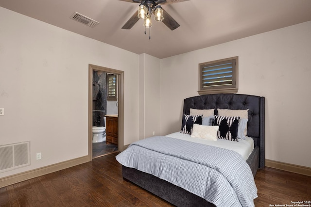 bedroom featuring baseboards, visible vents, and wood finished floors