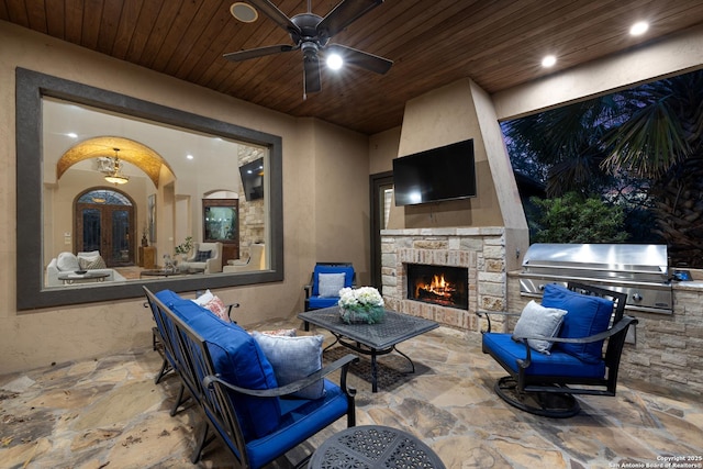 view of patio with area for grilling, a ceiling fan, french doors, grilling area, and an outdoor living space with a fireplace