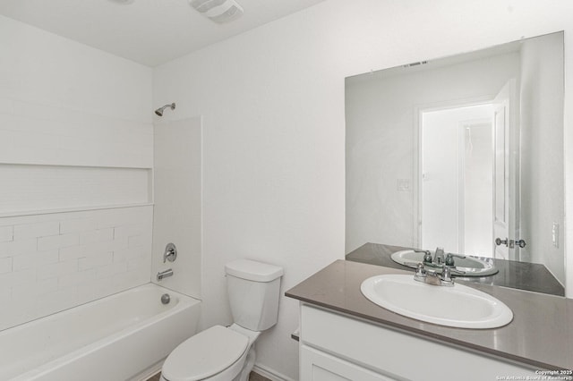 bathroom featuring visible vents, shower / tub combination, vanity, and toilet