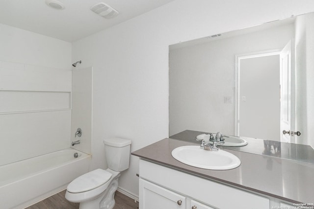 bathroom with toilet, wood finished floors, bathing tub / shower combination, vanity, and visible vents