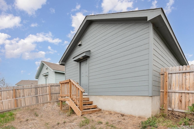 back of property with fence