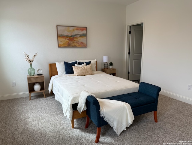 bedroom with carpet and baseboards