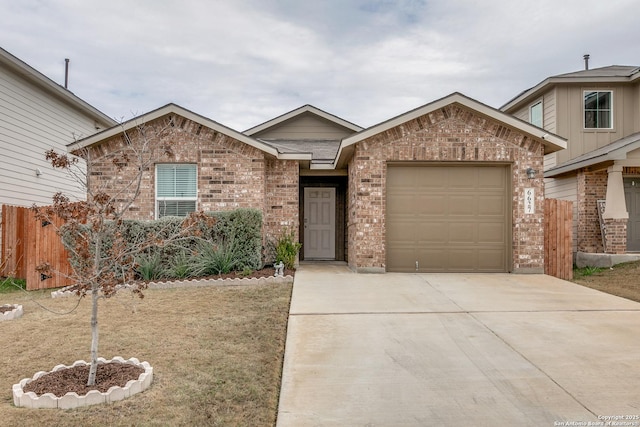 single story home with driveway, brick siding, an attached garage, and fence