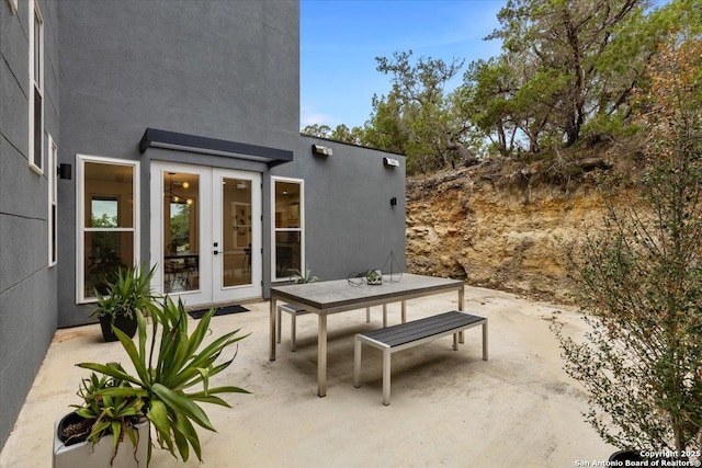 view of patio / terrace with french doors and outdoor dining area