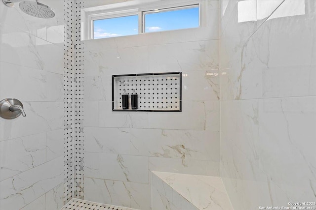 bathroom featuring tiled shower