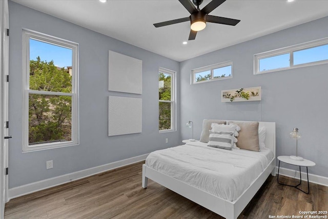 bedroom with recessed lighting, ceiling fan, baseboards, and wood finished floors