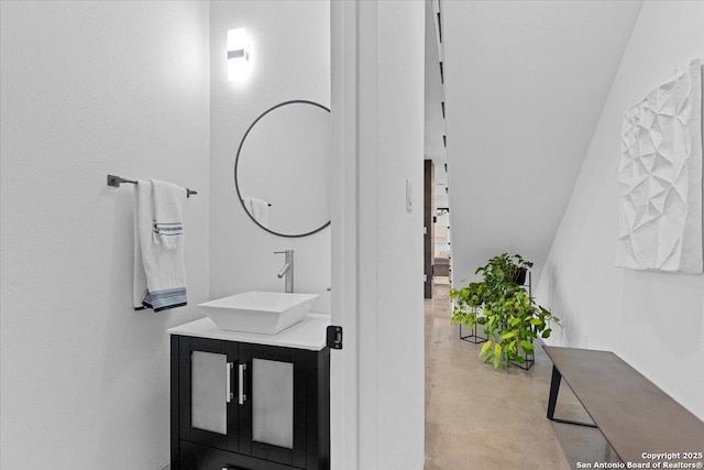 bathroom with finished concrete flooring and vanity