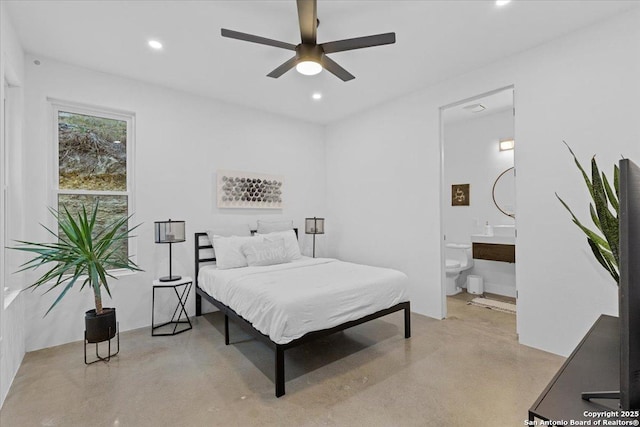 bedroom featuring ensuite bathroom, concrete floors, a ceiling fan, and recessed lighting