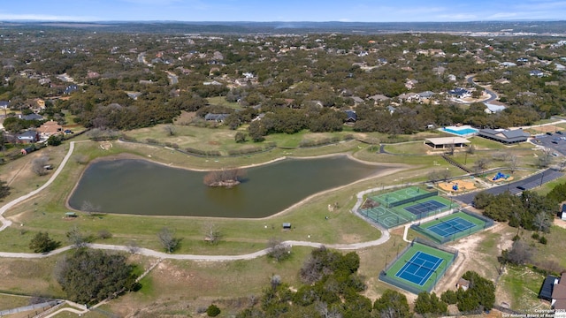 birds eye view of property with a water view