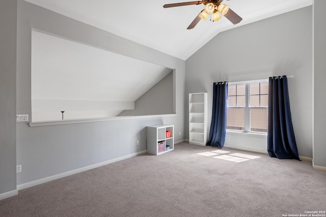 additional living space with a ceiling fan, carpet, lofted ceiling, and baseboards