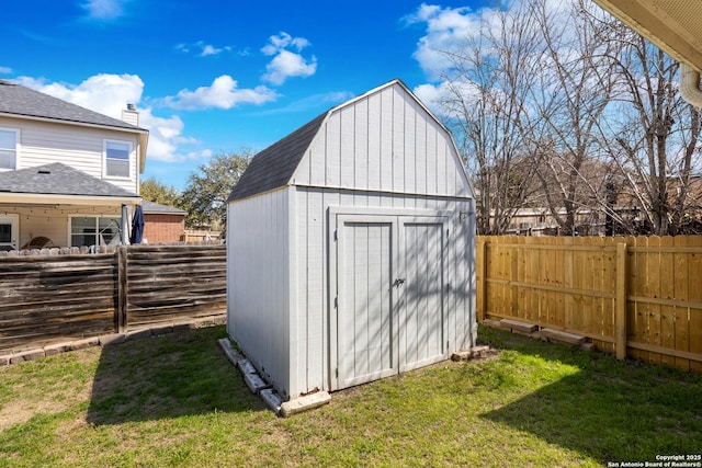 view of shed with a fenced backyard