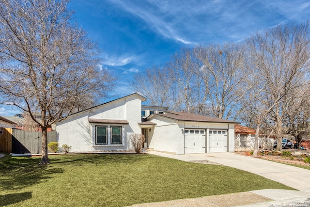 mid-century inspired home with driveway, an attached garage, a front yard, and brick siding