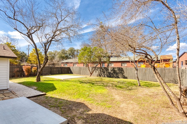 view of yard with a patio area and a fenced backyard