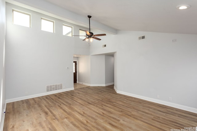 unfurnished room featuring baseboards, visible vents, and light wood-style flooring