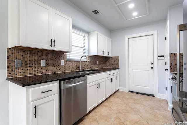 kitchen with visible vents, dark stone counters, dishwasher, backsplash, and a sink