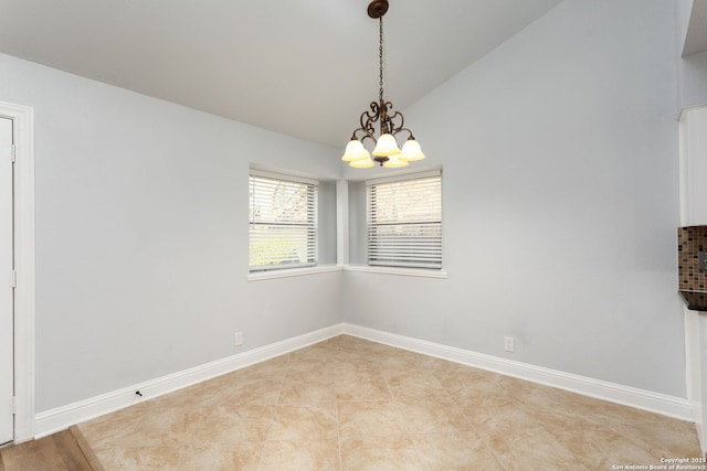 spare room with light tile patterned floors, baseboards, vaulted ceiling, and a notable chandelier